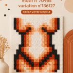 Un échantillon de motifs alpha colorés appliqués sur du tissu.